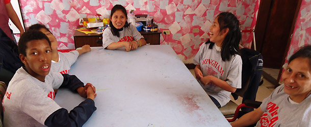 An intern in education works in a school in Quito teaching English and computer skills